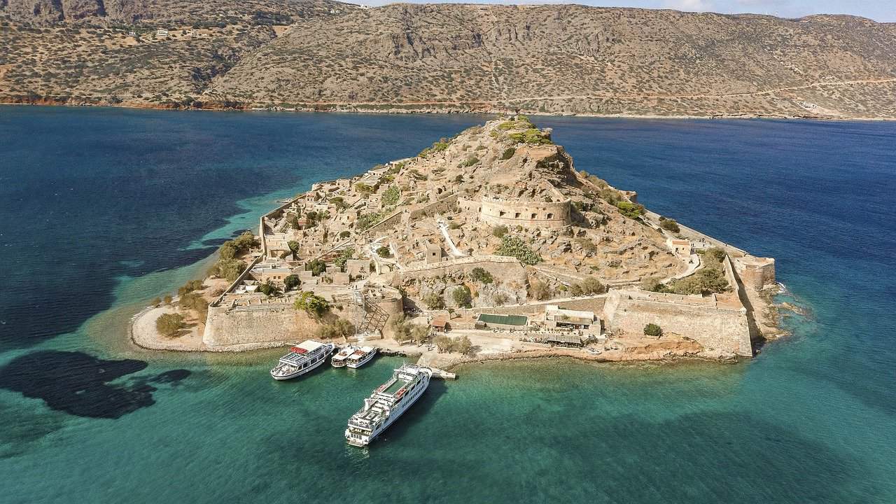 islet of Spinalonga is located between the town of Elounda and Mirabello Bay