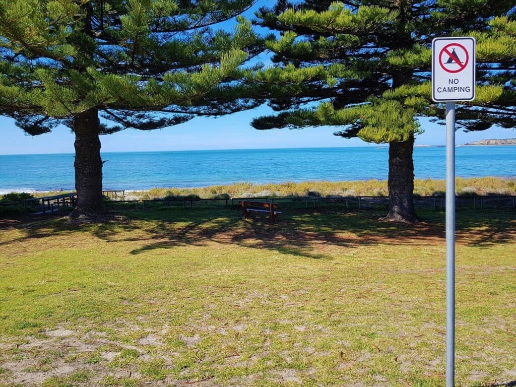 no camping sign on a beach site